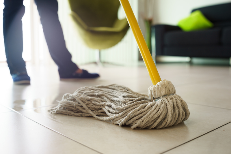 Woman Doing Chores Cleaning Floor